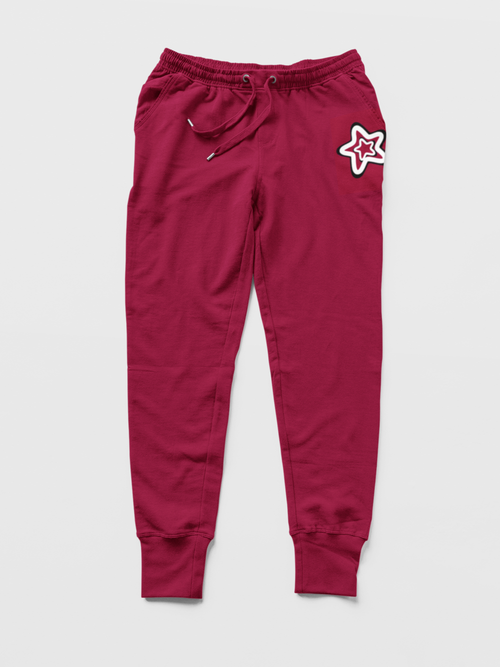 Maroon sweatpants with a star design on a light gray background